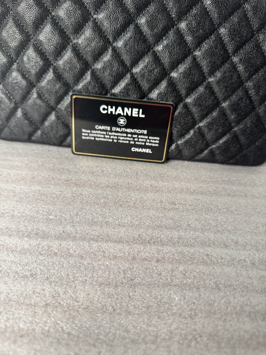 Back view of black quilted clutch
