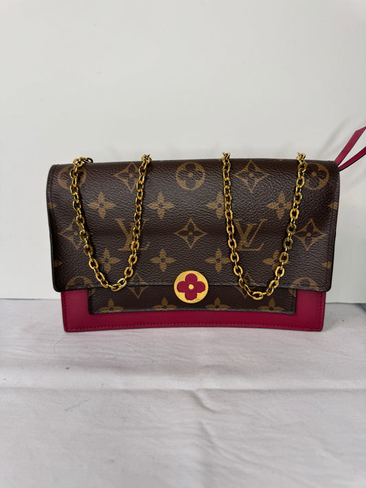 Front of Louis Vuitton brown monogram shoulder bag with burgundy accents and gold-tone chain