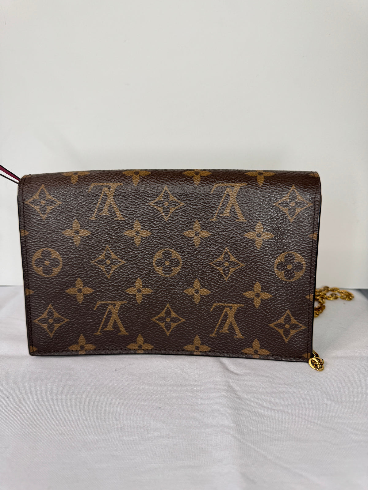 Back of Louis Vuitton brown monogram shoulder bag