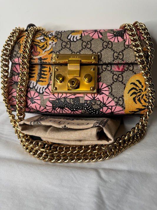 Front of Gucci GG monogram tiger and pink floral print bag with gold-tone chain strap