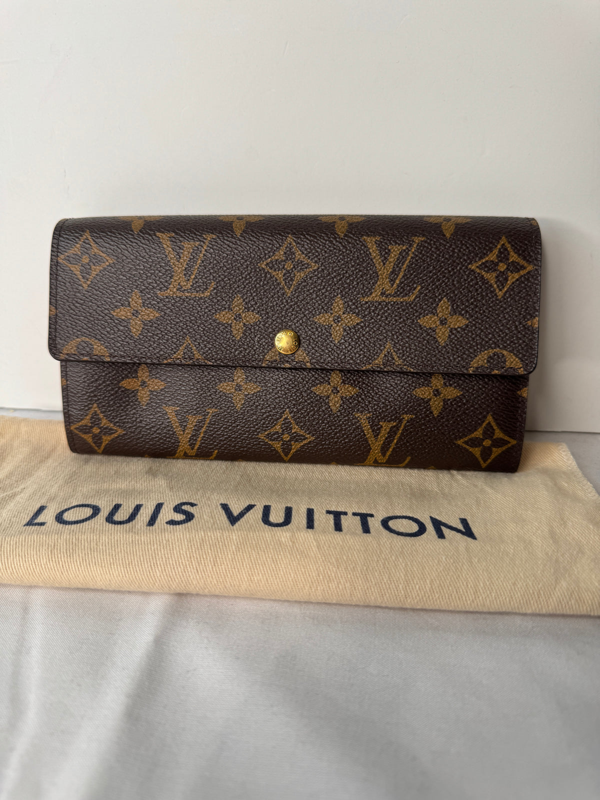 Wallet open, showing the pink leopard-print interior