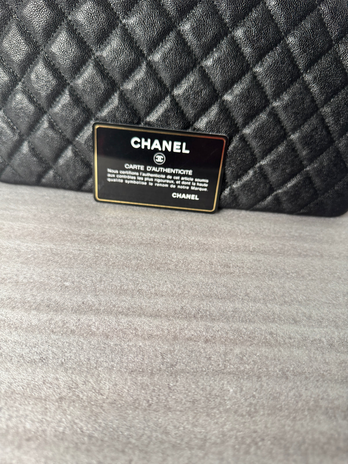 Back view of black quilted clutch