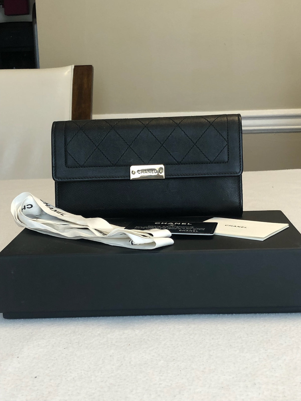 Chanel black diamond-quilted flap wallet, front view